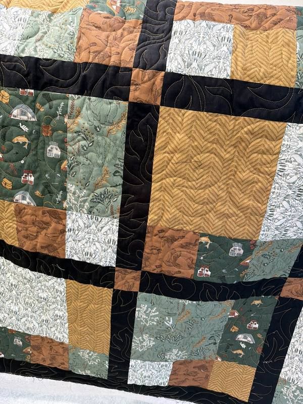 Outdoorsman quilt with nature and wildlife fabrics