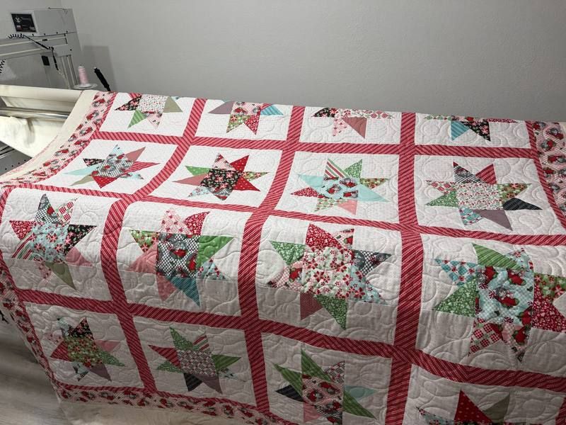 Christmas star quilt on the longarm machine