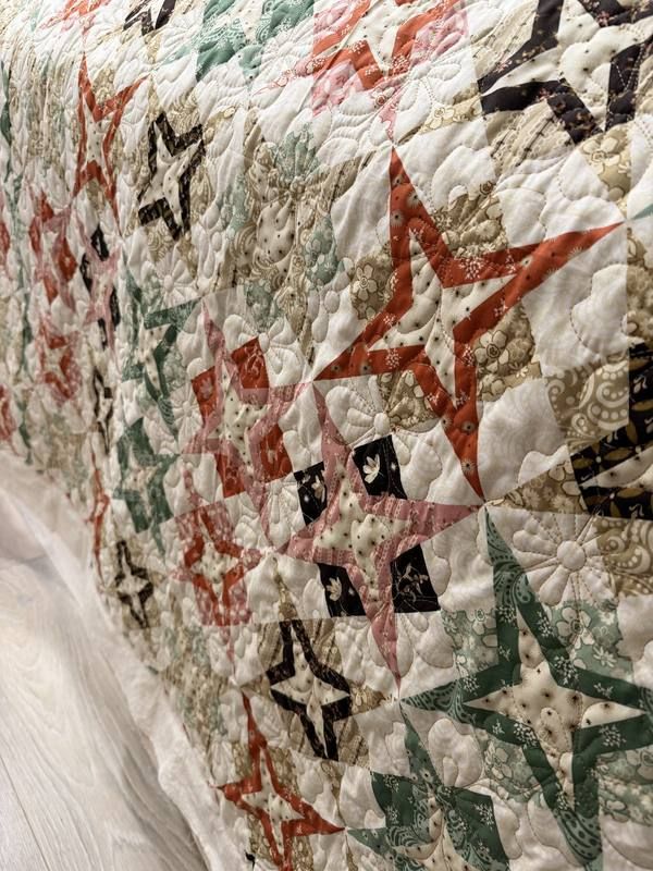 Leaf feather on geometric quilt
