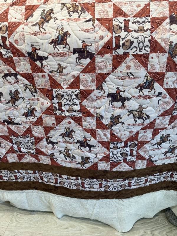 Western cowboy pinwheel star quilt in russet tones