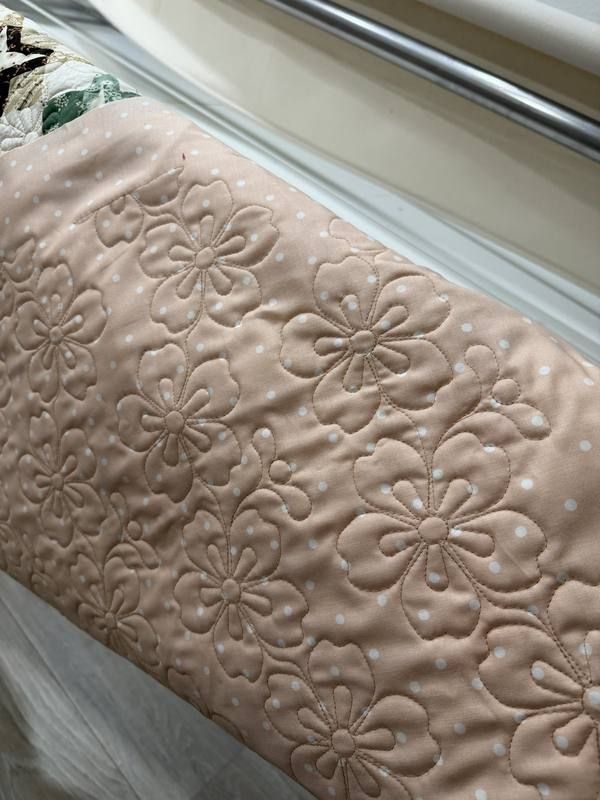 Clamshell fan stitching on peach polka dot fabric