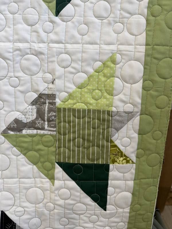 Bubble circle pantograph on green and white star quilt