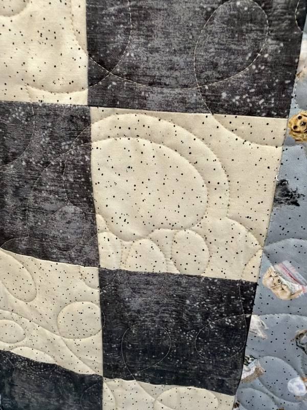 Swirl pebble stitch on gray and cream quilt