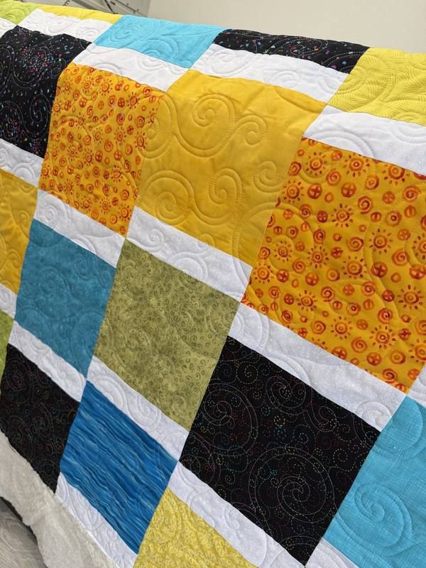 Color block quilt in sunshine yellow teal and black